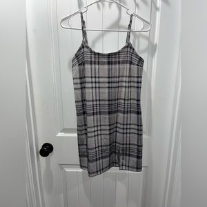 Grey and black plaid dress. Small slit. Adjustable straps.